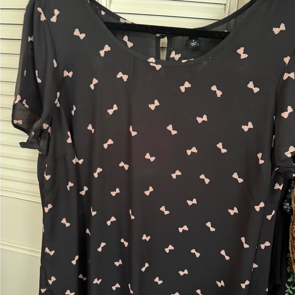Torrid Blouse with Short Sleeves with pink bows, button closure on back.